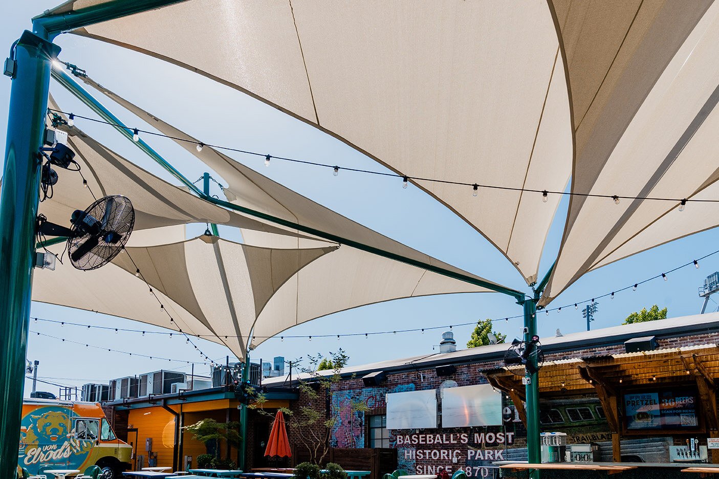 Shading Success: Sand Dollar Sail Shade Structures Transforming Von Elrod's Beer Garden